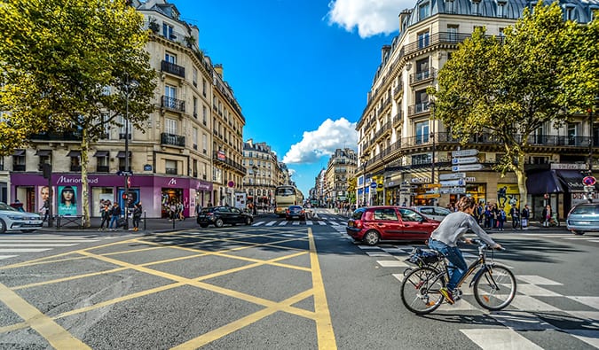 a person cycling through the streets of Paris