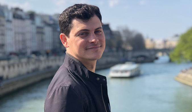 Matt Kepnes on a bridge over a canal in Paris