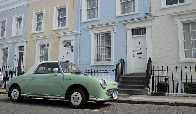 pastel colored homes with a vintage car in Notting Hill