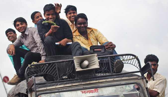 travelers on the top of a car