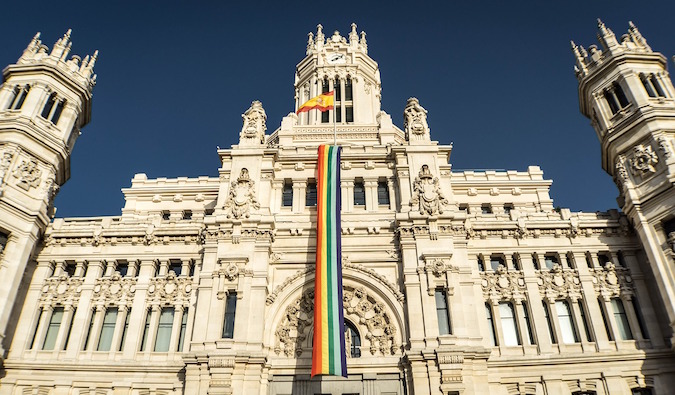 Gay LGBT pride flag hanging in Spain architecture