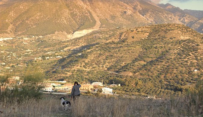 Walking the dog in the hills of Costa del Sol in Spain