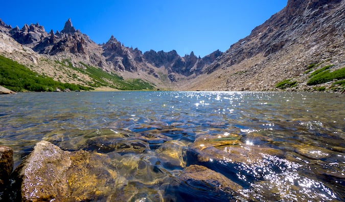 Calm waters in a valley near Refugio Frey on a bright and sunny day