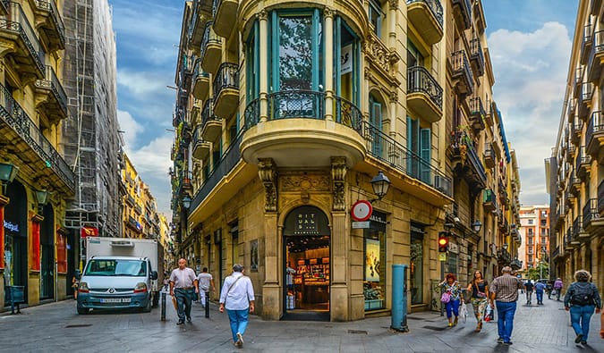 Barcelona's gothic quarter on a sunny day with people exploring and walking around