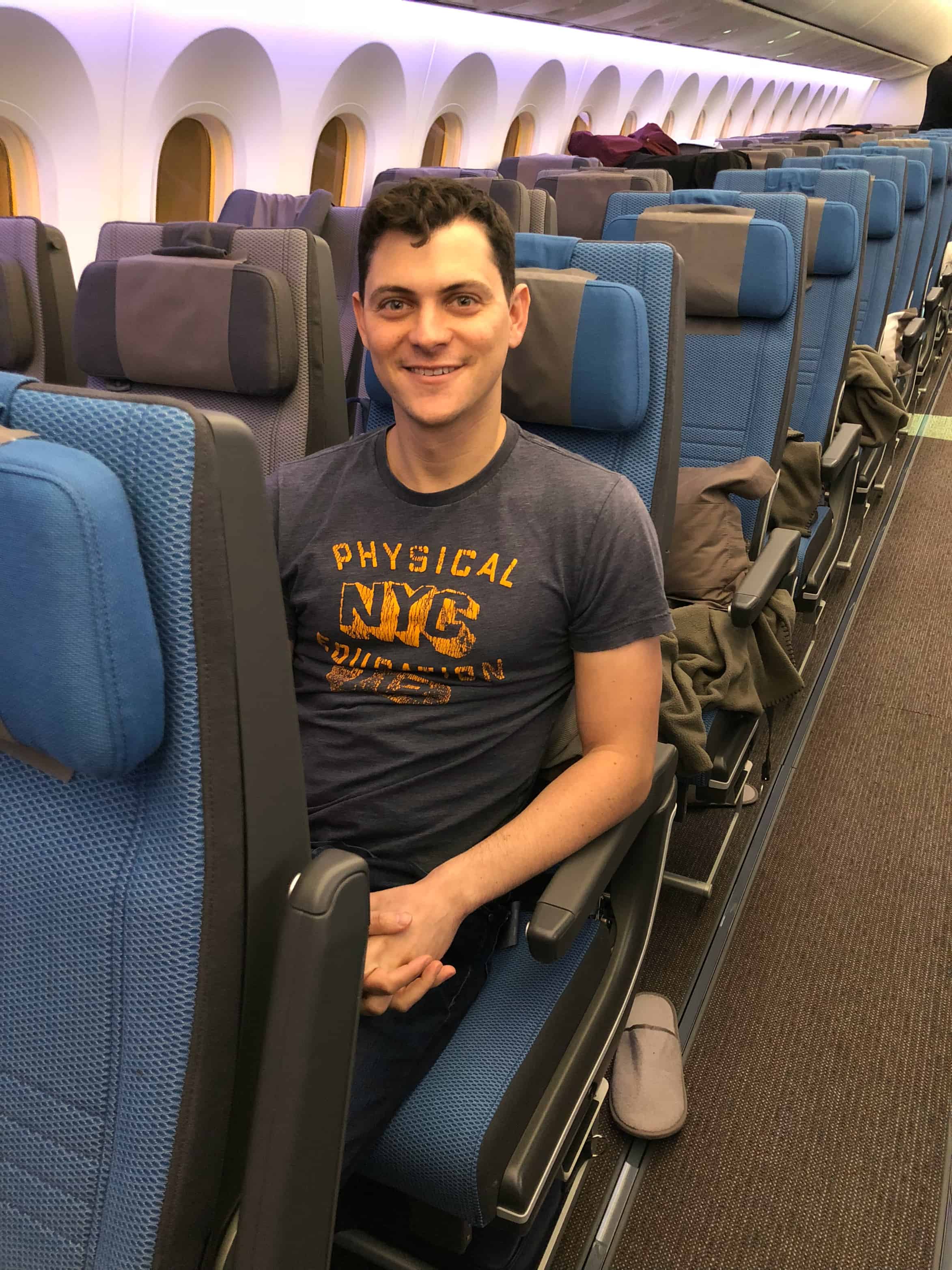 Matt Kepnes sitting in economy class on Singapore Airlines' new Dreamliner