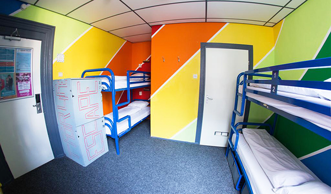 Bunk beds in brightly colored dorm room at The Flying Pig Hostels