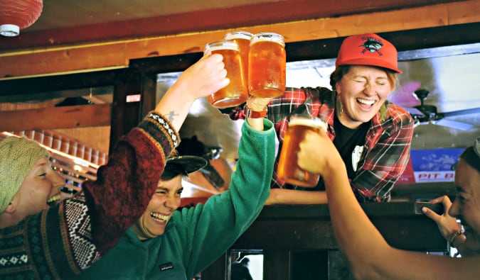 A group of travelers having fun and drinking beer