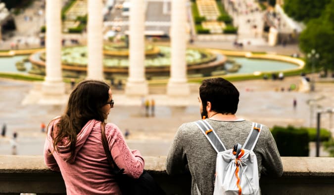 A pair of solo travelers engaged in a conversation together