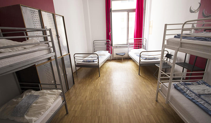 Simple bunk beds and twin beds in dorm room at Heart of Gold Hostel, Berlin
