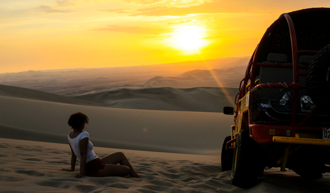 Heather posing in the sand at sunset