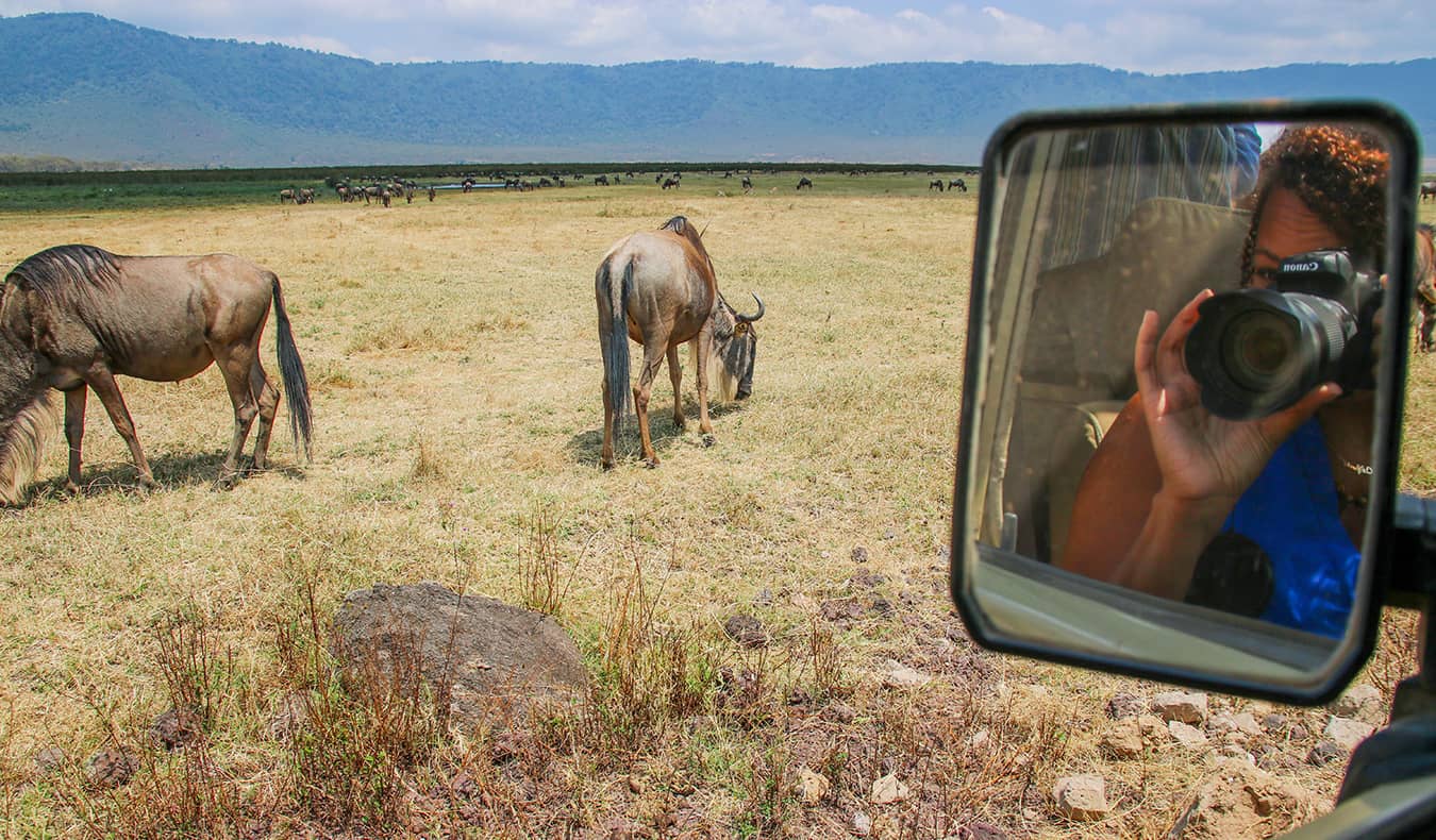 Heather on safari in Africa taking photos of animals