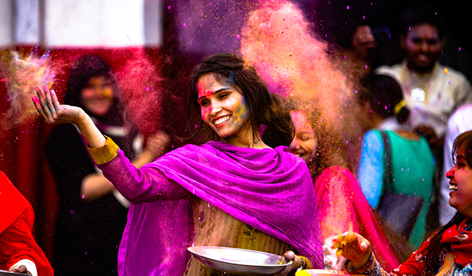 A woman getting colored at Holi in India
