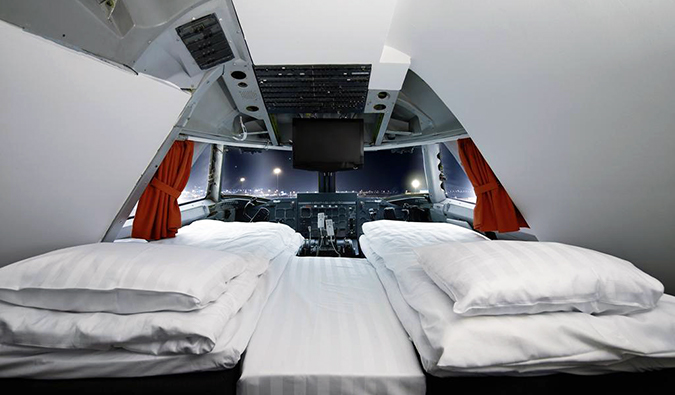 Two twin beds behind plane cockpit at Jumbo Stay, Stockholm
