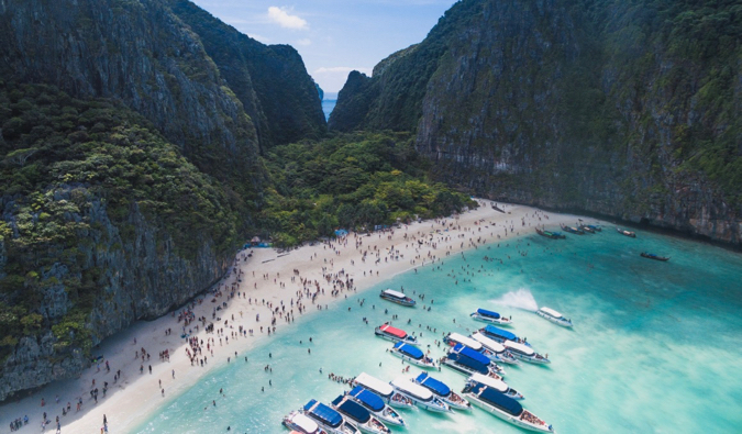 a crowded beach on Koh Phi Phi in Thailand