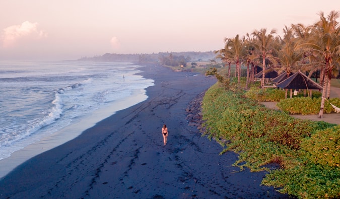 Kristin, a solo female traveler, on the beach of a resort overseas