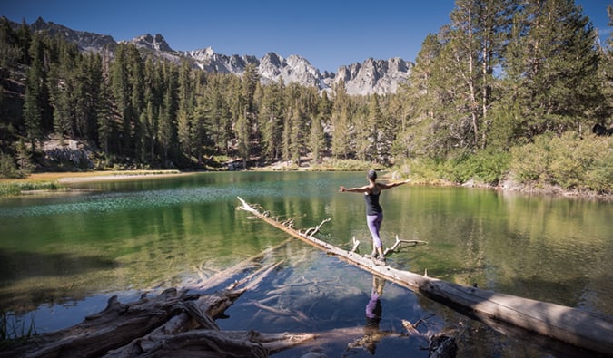 Kristin, a solo female traveler, hiking in a scenic mountain landscape