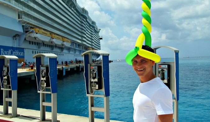 Nomadic Matt having a happy time with a silly hat on his cruise