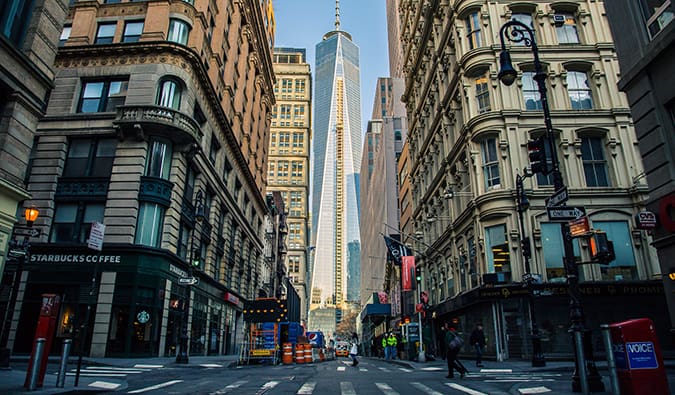 New York City street view with towering buildings on both sides of a busy road in Manhattan, NYC