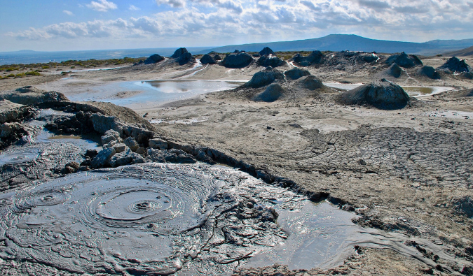 mud volcanoes bubbling up on rocky terrain in Azerbaijan