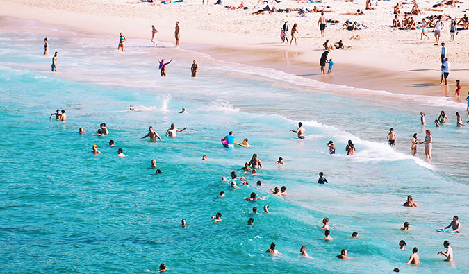 People swimming at one of the many beautiful beaches in Australia