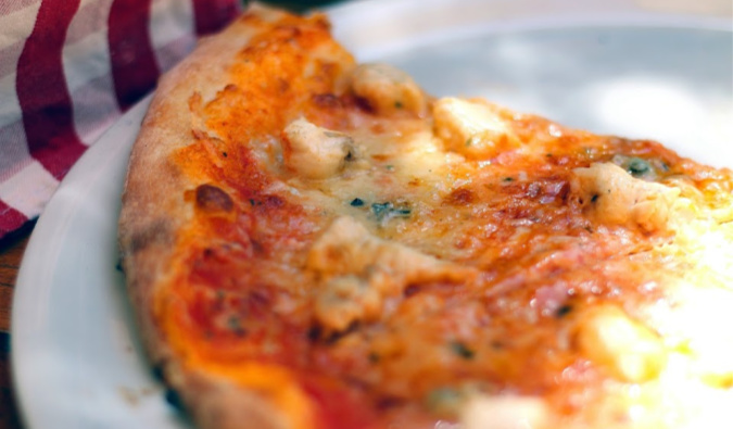 a fresh slice of New York pizza from a restaurant in NYC