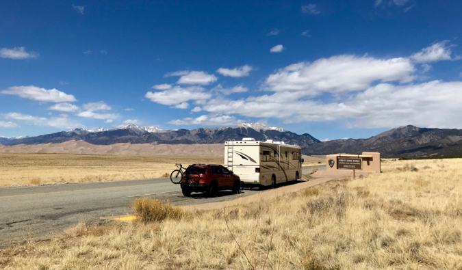 an RV for long-term travel parked on the side of the road