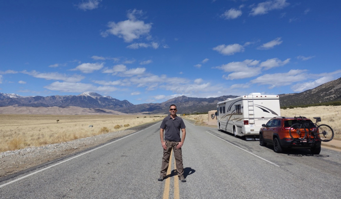 marc from RV Love standing in the road on a road trip