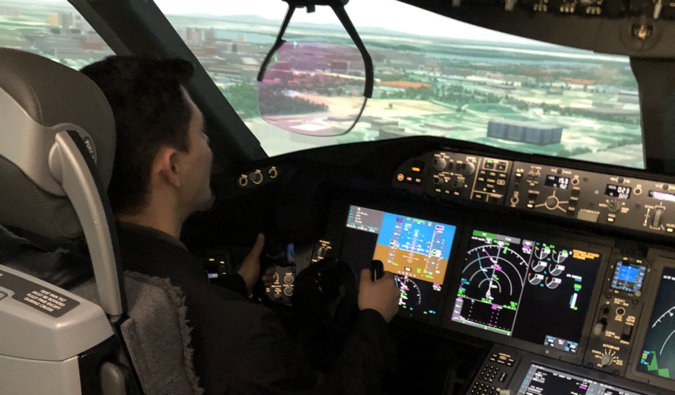 Nomadic Matt flying in a flight simulator