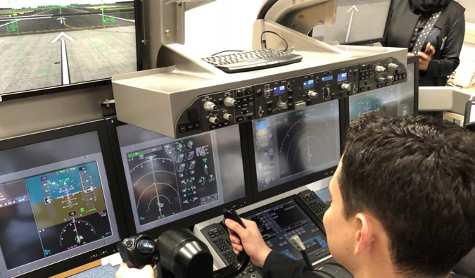 Nomadic Matt flying in a flight simulator