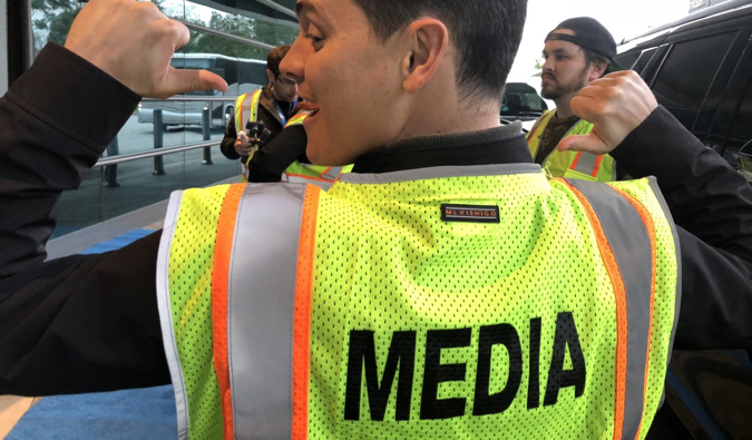 Nomadic Matt wearing a bright media vest