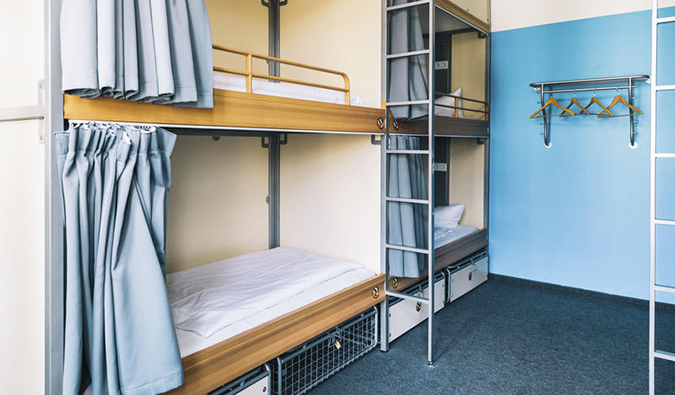 Built in bunk beds with privacy curtains at St. Christopher's, Berlin