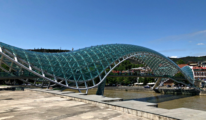 A large pedestrian bridge made of glass in Tbilisi, Georgia