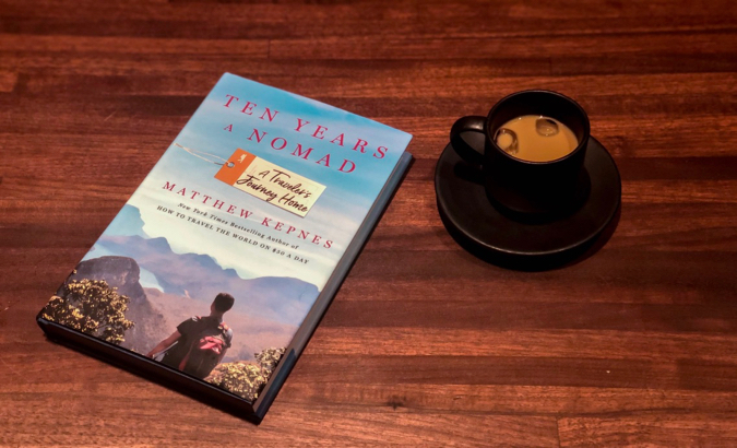 Ten Years a Nomad by Matt Kepnes on a table with a coffee