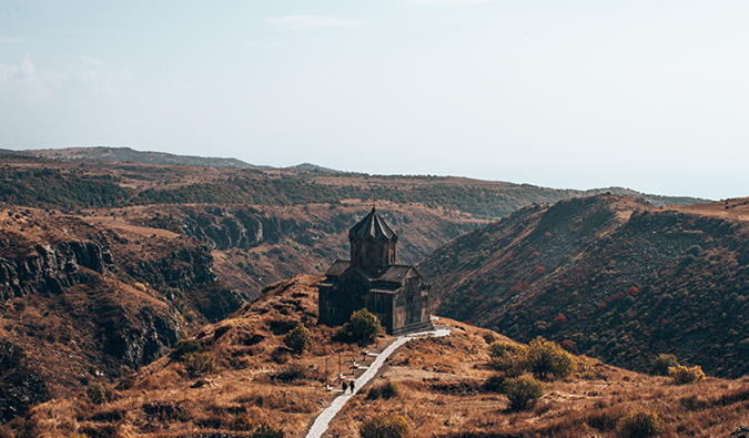 aerial view of a church in the mountains in Armenia