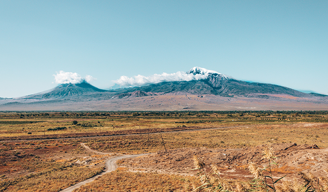 a road leading to snow-capped mountains in Armenia