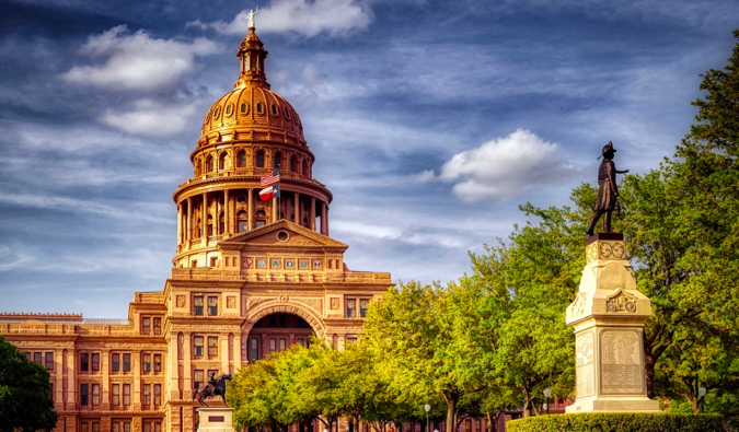 The capitol building and a statue in Austin, Texas