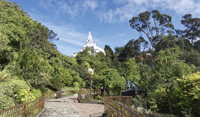 The old church surrounded by trees at the top of Monserrate in Bogota