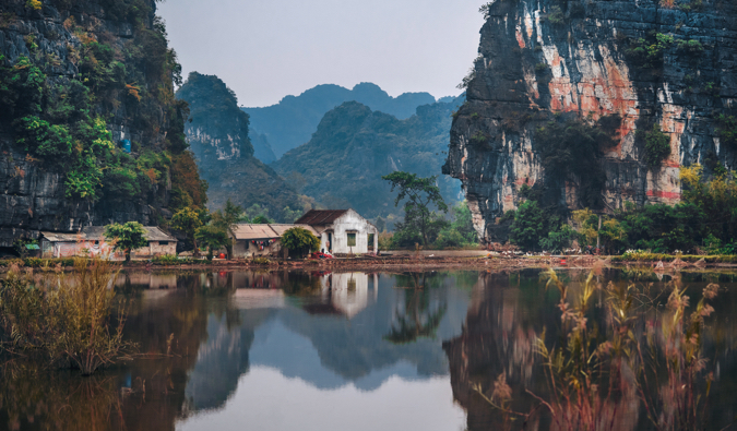 A small house between two tall cliffs in Vietnam