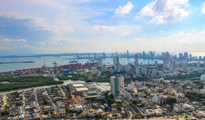 The skyline of Cartegena, Colombia on a sunny day with skyscrapers and the port in view