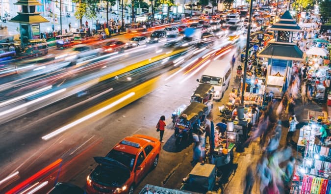 A long-exposure shot of the hectic streets of Bangkok, Thailand at night