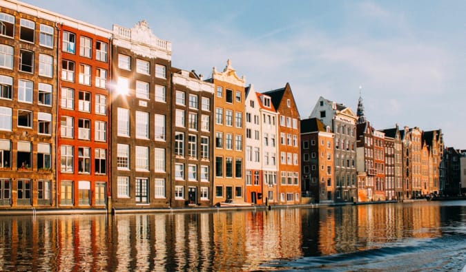 The historic buildings of Amsterdam that line the narrow canal