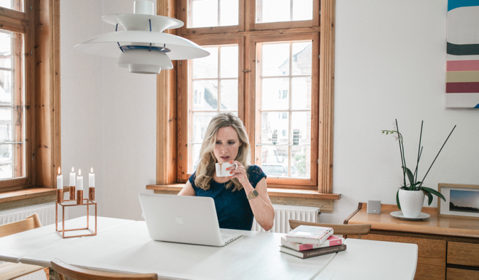 Best selling author Helen Russell working on her laptop