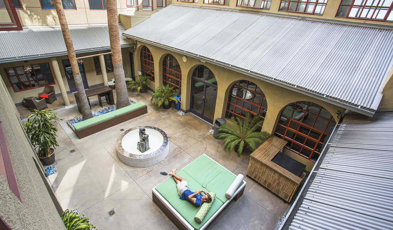 Inner courtyard with outdoor couches at HI Los Angeles Santa Monica in Los Angeles