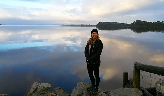 Isabella in front of a calm lake