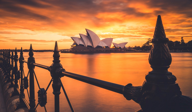 A vivid sunset photo of the Sydney Opera in Australia