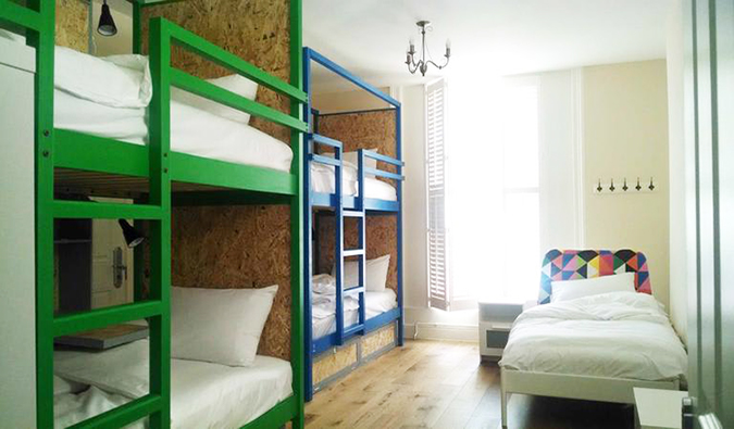 Bunk beds and single twin bed in dorm room at Park Villa, London