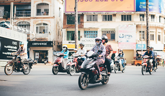 a group of locals riding motorbikes in Vietnam