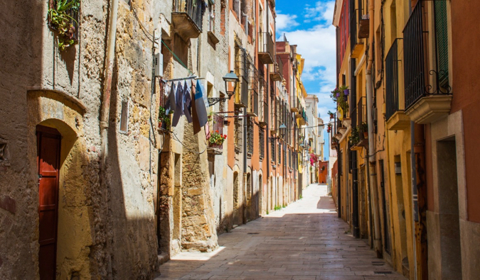 A narrow and winding alley in a traditional area of Cataluna, Spain