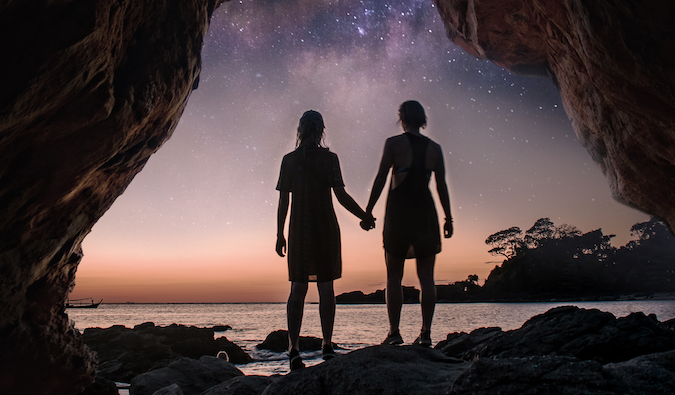 Charlotte and Natalie in front of a starry sky in Asia