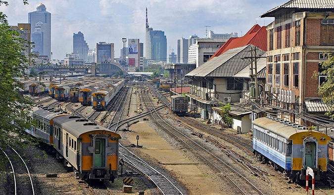 a busy train yard in Bangkok, Thailand